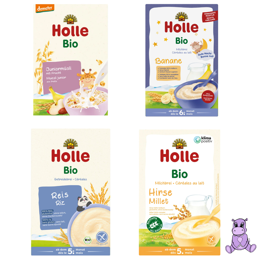 Four packages of Holle Bio baby food on a white background