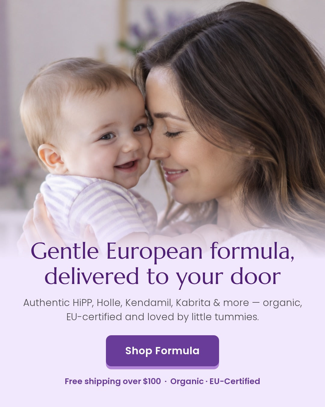 Smiling mother holding her baby boy close in a soft lilac nursery - HolleHiPPos European organic baby formula